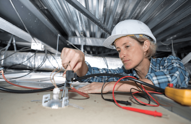 Electrician carrying out electrical work in the UK